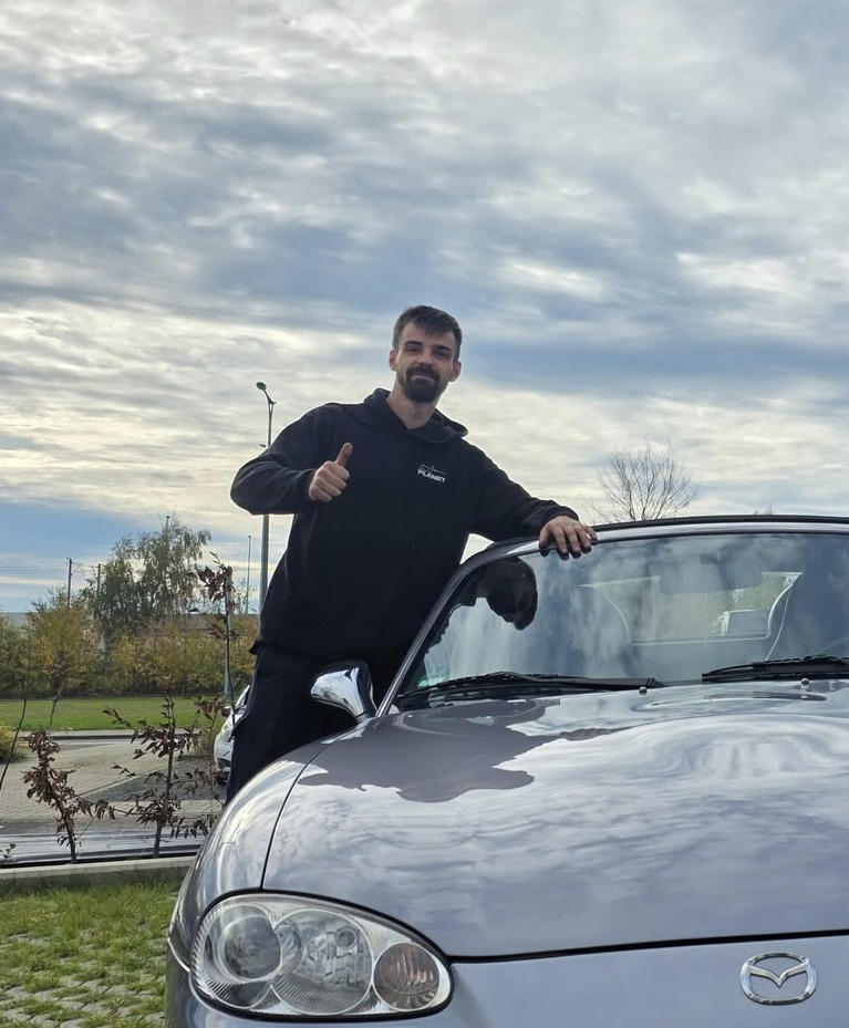 Gigi working on a Miata
